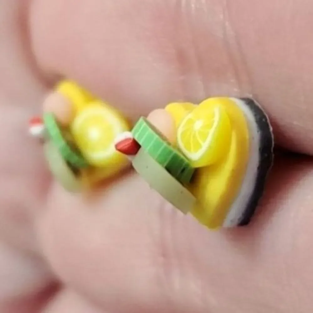 Silver tone heart-shaped dessert earrings